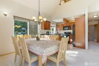 Dining space positioned beneath dramatic rooflines, offering a unique and intimate setting.