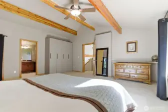 Private upper-level sanctuary with unique ceiling lines and cozy proportions—perfect for restful nights in a tranquil setting.