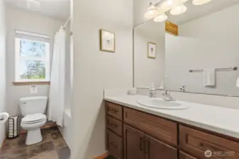 Main floor full bathroom is ready for guest and family alike.