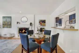 Dining space that opens to the kitchen with bar top pass through.