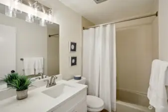 Nicely updated bathroom with new floors, vanity and fresh paint