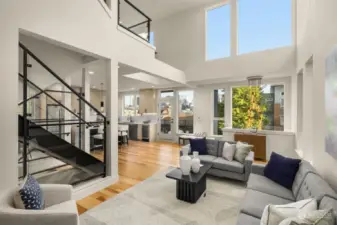 A rare mezzanine level creates an airy ambiance with double-height ceilings over the living area, complete with quartz-topped kitchens, floating islands, and breakfast bars.