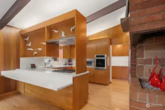 Spacious, efficient, and beautiful.  White quartz counters contrast nicely with the beautifully-restored original kitchen cabinets.