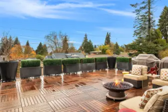 Stunning Ipe planks in a cheeky parquet pattern cover solid-surface decking with drainage for water-proof covering to the secure/enclosed carport below.   A west-facing outlook lets you soak in every last drop of sunshine whether the days are short or long.