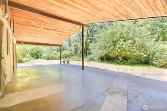 Covered back patio where you can enjoy the yard year around!