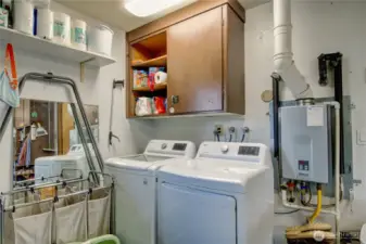 Laundry in the garage.  Tankless water heater (202)