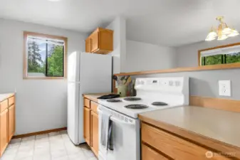 Kitchen! This is an end unit with the bonus of a kitchen window! Open to dining room.