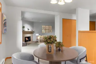 Virtually staged Dining area to living room. Note the closets to the right along the hallway. Amazing panty and storage areas to stay organized.