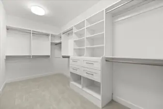 Spacious primary walk-in with custom shelving