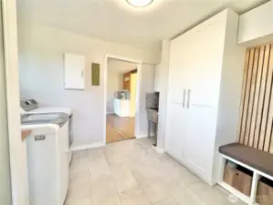 Main home back entry utility room with deep sink.
