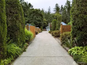 Say Yes to this address. Welcome to #7120 242nd St E, Graham, WA 98338. Gated entry. 3 bedrooms, 2.5 bathrooms & 7 covered parking spaces. .295 acre private location. No HOA!. Private setting backs up to greenbelt