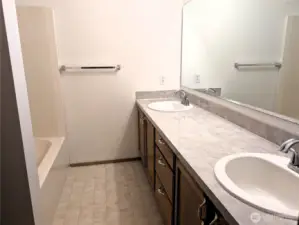 Primary bathroom with dual sinks. Say Yes to this address.  #7120 242nd St E, Graham, WA 98338. New carpet to be intalled prior to closing.