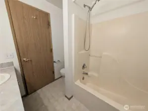 Primary bathroom with dual sinks. Say Yes to this address.  #7120 242nd St E, Graham, WA 98338. New carpet to be intalled prior to closing.