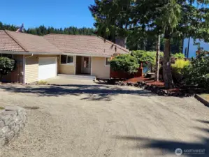 Circular driveway and a 2 car garage