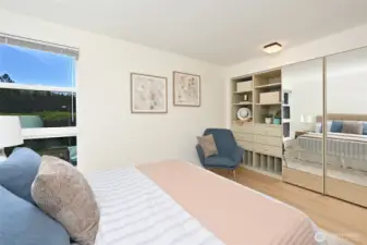 Built in closet storage adds function and organization to the large second bedroom.