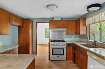 Open kitchen with updated granite counter tops.