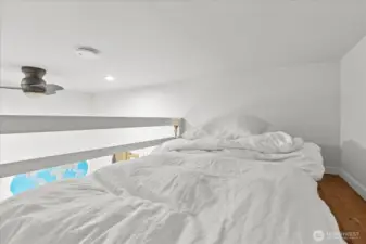 Main level - Loft bedroom offers built-in platform for a full size bed.