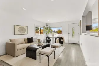 Bright and modern main living area at 4612 N 21st St, Tacoma, WA — featuring wide-plank flooring, large dual-pane windows with natural light, open layout, stylish neutral décor, and a cozy dining nook with views of the neighborhood. This beautifully updated North Tacoma home offers an inviting entry and seamless flow perfect for comfortable living and entertaining.