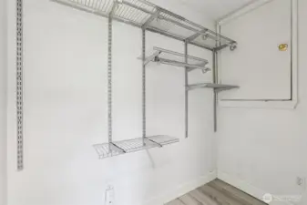 Additional storage space at 4612 N 21st St, Tacoma, WA — featuring built-in wire shelving, durable flooring, and convenient access to the attic. This flexible North Tacoma storage area is perfect for seasonal items, organization needs, or expanding closet capacity in the home.