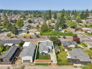 Aerial view of 4612 N 21st St, Tacoma, WA — highlighting the full property boundaries, fenced backyard, driveway access, and prime North Tacoma location. Surrounded by established neighborhoods, parks, schools, and local amenities, this home offers convenient access to commuting routes and the desirable lifestyle of the North End. No HOA!