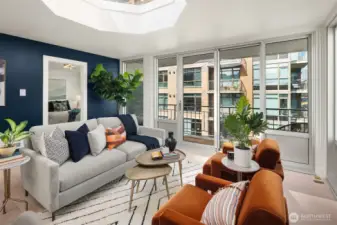 Spacious living room with multiple configuration options, looking toward primary bedroom suite