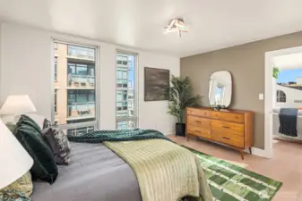 Primary bedroom boasts views, all new paint, flooring, and lighting