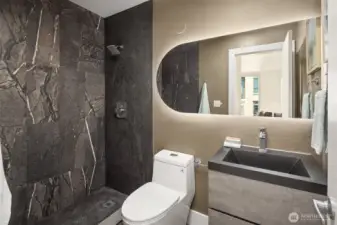 All new primary ensuite bathroom with natural stone shower and floor tile