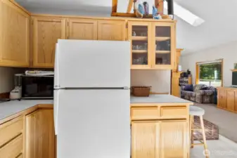 Plenty of cabinetry and storage in the bright, functional kitchen.