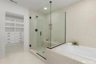 Primary bathroom and walk in closet.