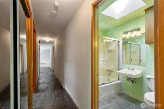 Full bath on main floor. Look at these AMAZING  slate floors.