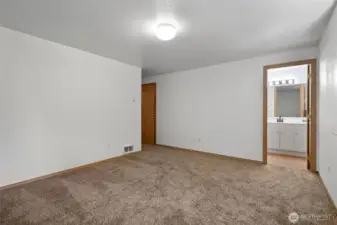 Primary bedroom and full bathroom