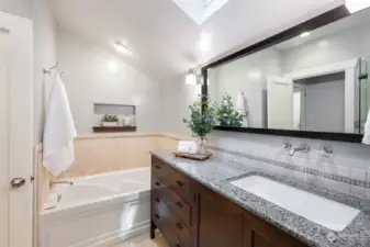 Primary en suite with soaking tub, heated floors and walk in shower.