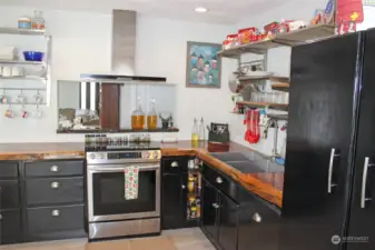 Live edge epoxied wood countertop. Specialty wood kitchen accents include Redwood, Black Walnut and Yew wood.