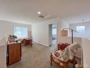 The loft is multi-functional- it can become multiple hobby spaces, workstations, reading nooks, an entertainment corner complete with a couch and large screen tv- or a perfect spot for a daybed (with a trundle!) for visitors.