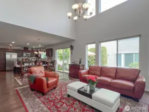 Vaulted ceilings, light walls, and large windows spanning almost entire back width of the home bring in exceptional light throughout the year, even if you choose to lower blinds.