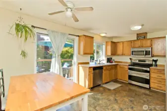 Kitchen with room for a breakfast table  and sliders to outside deck