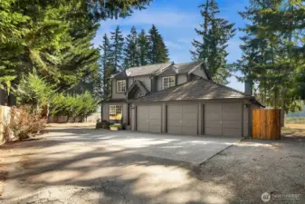 Charming home on peaceful 2.6-acre property with welcoming front entry.