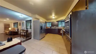 Open Kitchen with tile floors, granite countertops and stainless appliances