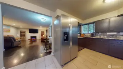 This kitchen and living space are over half the square footage of the house.