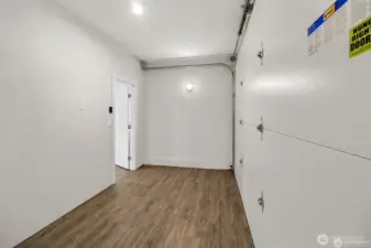 Garage storage off the DADU. Garage door is fully operational for whatever you want to roll in here