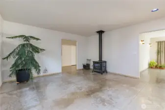 Living room features a cozy wood-burning stove