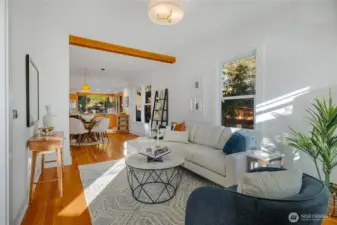 the gorgeous fir floors carry into the sunlit living room