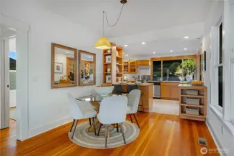 the gorgeous fir floors carry into the sunlit living room