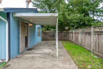 Side of home featuring covered patio area!