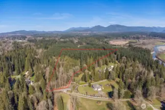 Bounday is approximate. The back side of property backs up to a tree farm. Note the Stilliguamish River to the right. The community has community access to the river.