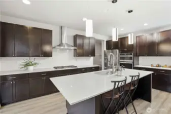 This kitchen is a chef's dream with lots of storage and counterspace to work on this super island!