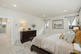 Primary suite with large full bathroom ensuite. (some items digitally staged)