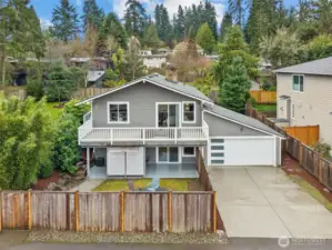 Front exterior of home on a large private cul-de-sac lot, featuring attached 2-car garage, expansive driveway, and elevated setting with territorial views.