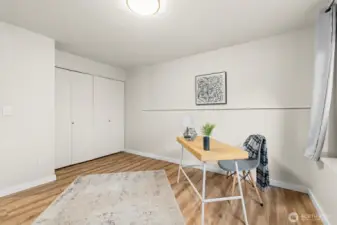 Versatile room with closet and clean modern finishes, ideal as a home office, guest bedroom, or workout space.