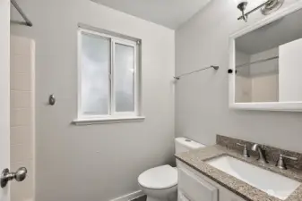 Full guest bathroom located on upper level with shower/tub combo.